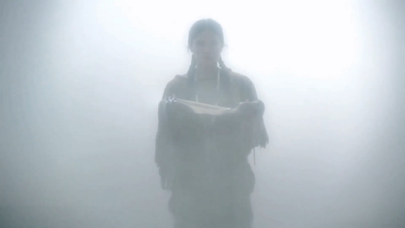 A figure appears through mist, representing the moment before the arrival of White Buffalo Calf Woman